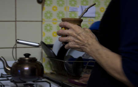 Argentina tradition mate and old woman's hand