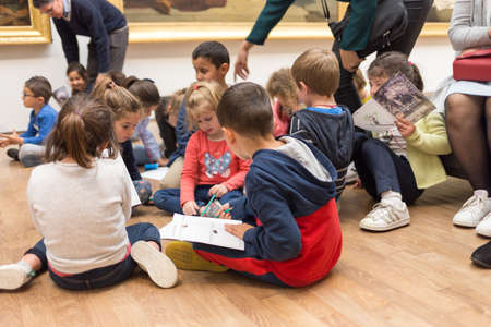 Angers, France - June 21 2019: Children visit the Museum of Fine Arts. kids plays inside museum, kids watching painting at gallery of arts, activity for preschoolers.のeditorial素材