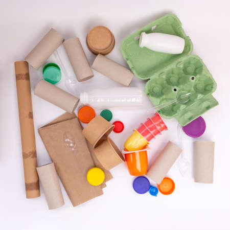 recycled craft ideas for kids, use of toilet paper rolls and other materials for creative projects, flat lay, white background, top viewの写真素材