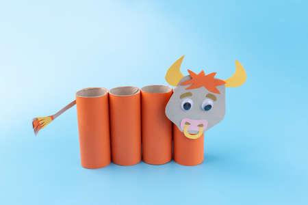 toilet paper roll craft concept, how to make a bull or cow, step by step instruction, simple activity for kids, pencil holder handmade gift for year of oxの写真素材