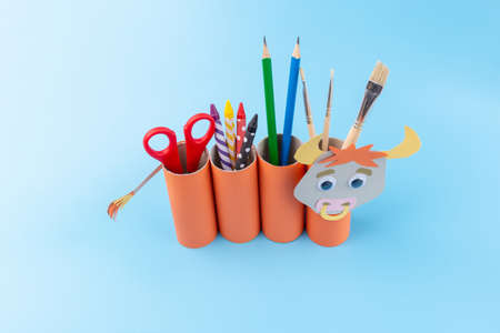 toilet paper roll craft concept, how to make a bull or cow, step by step instruction, simple activity for kids with parents, pencil holder handmade gift for year of ox, DIYの写真素材
