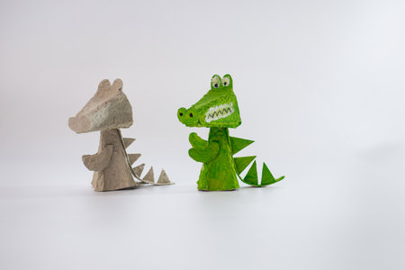 Eco-friendly crocodile craft, Recycling concept for kids art projects, sustainable creativity, DIY paper animals, environmental awareness.の写真素材