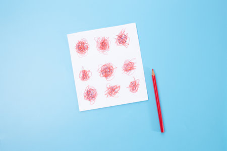 a red pencil and piece of paper with a childs drawing, part of process art, paper craft, easy craft ideas, how to make, DIY, school project, recycleの写真素材