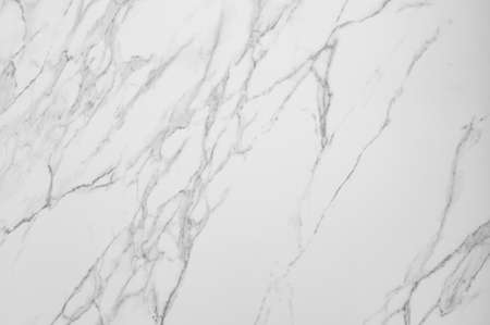 Natural stone texture of white Carrara marble, layered texture with dark veins. Finishing material for interior, wall tilesの写真素材