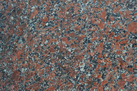 Texture of red spotted granite, natural polished stone, noisy texture Ukrainian granite.の写真素材