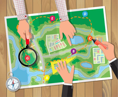 Wooden table with paper map and compass. Marker and magnifying glass in hands. Planning trip. Vector illustration in flat styleのイラスト素材