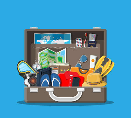 Packed suitcase with shoes, clothes and maps