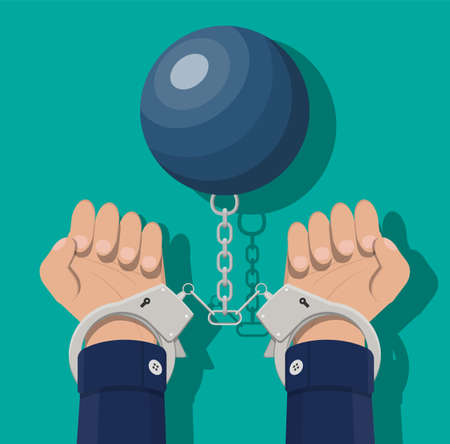 Human hands in handcuffs and weight ball.