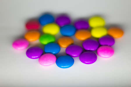 Colorful candies on a white background. Selective focus.