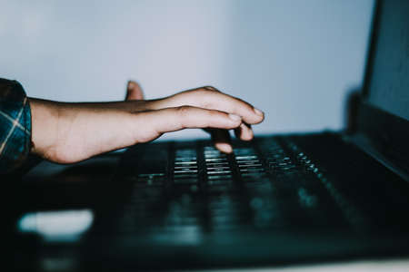 Mockup image of a hand touching on laptop computer touchpadの写真素材