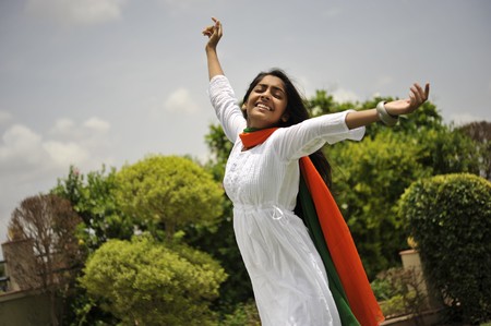 indian girl expressing freedom wearing tri colorの写真素材