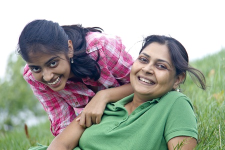 Loving mother daughter enjoying in parkの写真素材