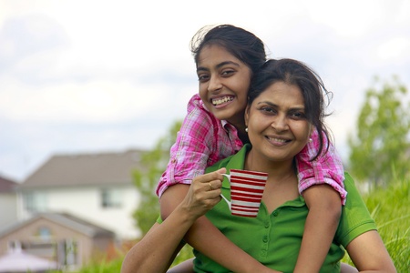 Loving mother daughter enjoying in parkの写真素材