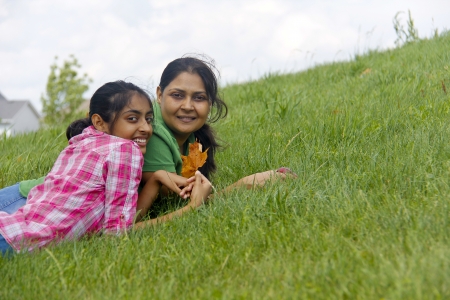 Loving mother daughter enjoying in parkの写真素材