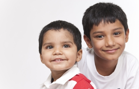 Two Indian brothers in indoorsの写真素材