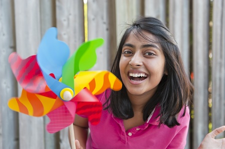 teenage girl holding pinweeh in outdoors
