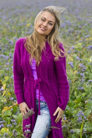 Happy woman in a flower fieldの写真素材