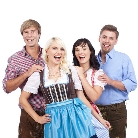 Four young people in traditional costumeの写真素材