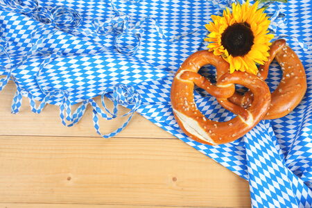 Salty bavarian pretzels on wooden boardの写真素材