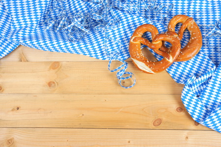 Salty bavarian pretzels on wooden boardの写真素材