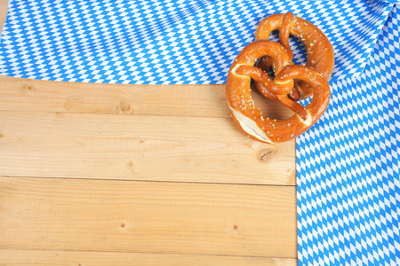 Salty bavarian pretzels on wooden boardの写真素材