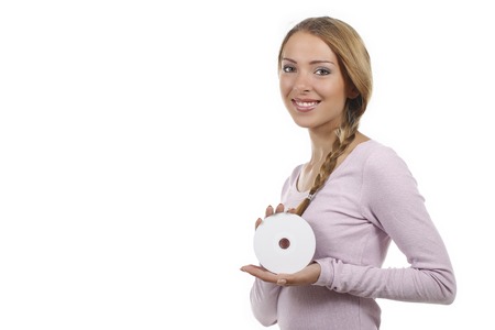 Young woman with DVD disc isolatedの写真素材