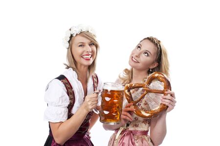 Two woman with dirndl  isolatedの写真素材