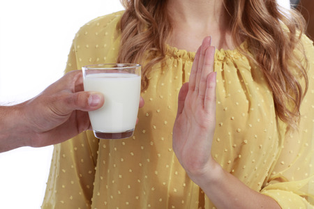 Woman with milk allergy isolatedの写真素材