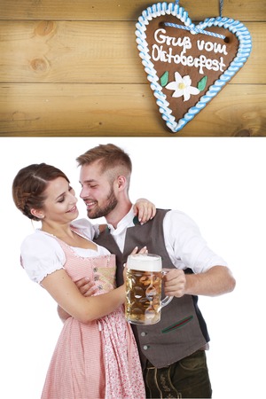 Young couple in traditional costume in bavaria having funの写真素材