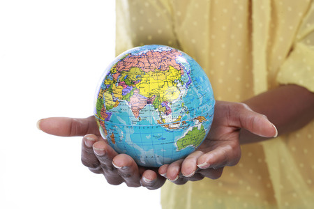 Black hands holding a globe