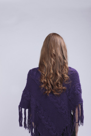 Red haired woman from the back with curlsの写真素材
