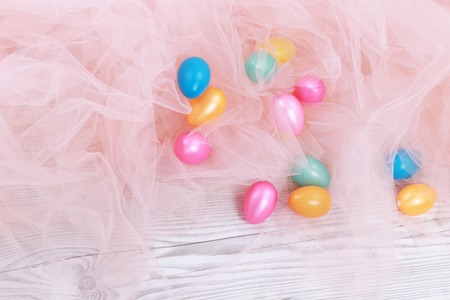 colored Easter eggs in rose tulleの写真素材