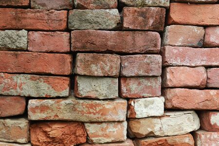 red old brick stones building a brick wall