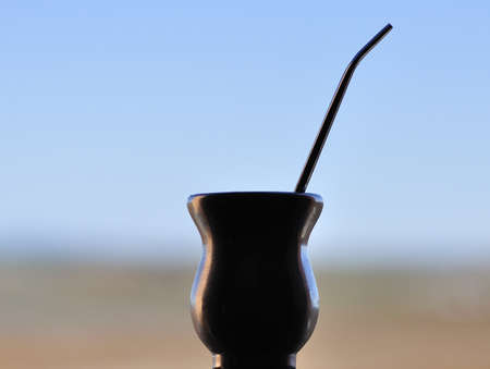 A recipient used for drinking tea mate with sky backgroundの写真素材