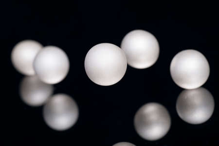 silver pearl balls on a black backgroundの写真素材