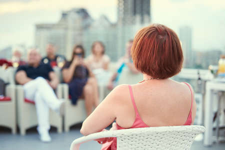 woman teacher gives a lecture for many peopleの写真素材
