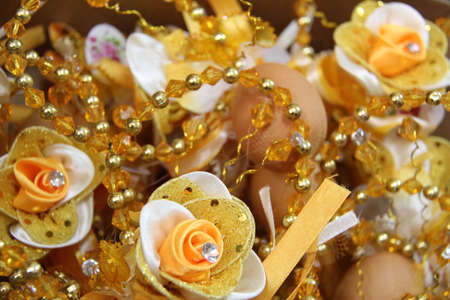 Decoration flower with egg or also known as 'bunga telur' in Malaysian culture isolated in white. Commonly bunga telur will be given to guest at wedding ceremony.の写真素材