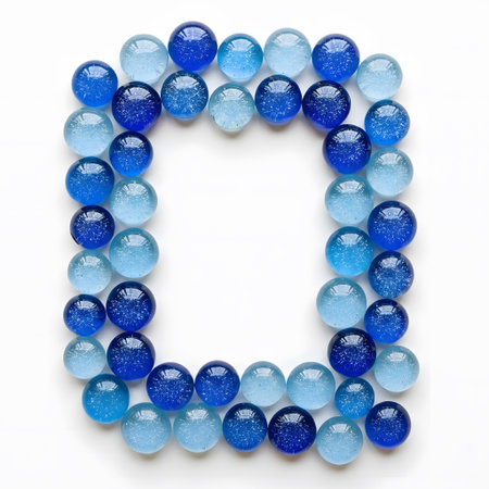Letter D of the alphabet made of blue glass beads on a white backgroundの素材