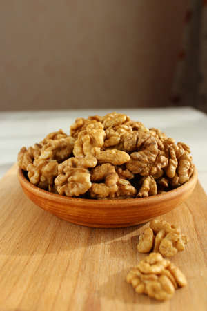 Walnut on the plate is a wooden Boardの写真素材