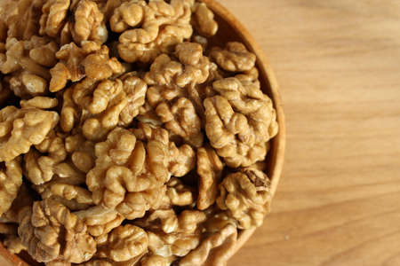 Walnut on the plate is a wooden Boardの写真素材
