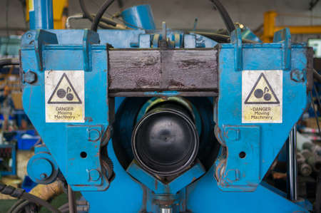 Torque machine with Danger Moving Machinery sign.