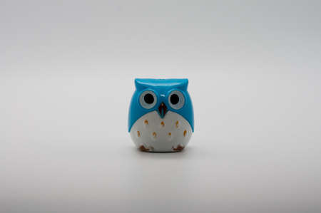 Smal plastic owl isolated on white background.の写真素材