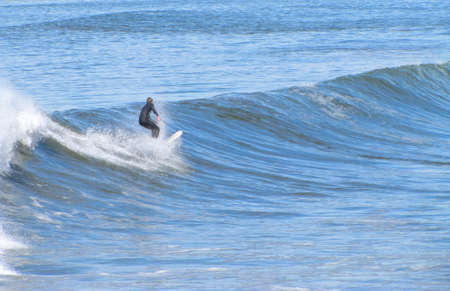 a man surfing a wave の写真素材