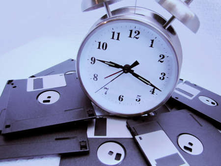 old fashion alarm around floppies disks の写真素材