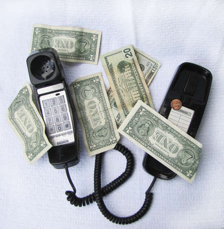 phone surrounded with money の写真素材