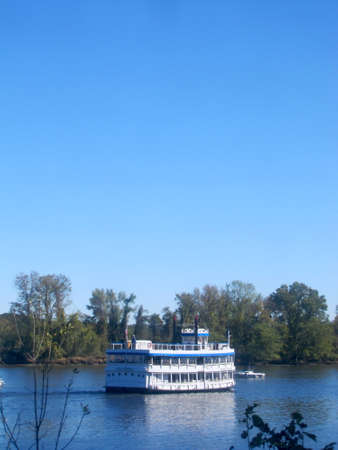 A boat navigates the Connecticut Riverの写真素材