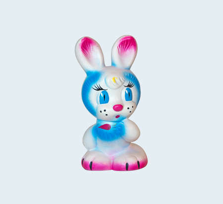 Old rubber toy in form of a colored rabbit for young childrenの写真素材