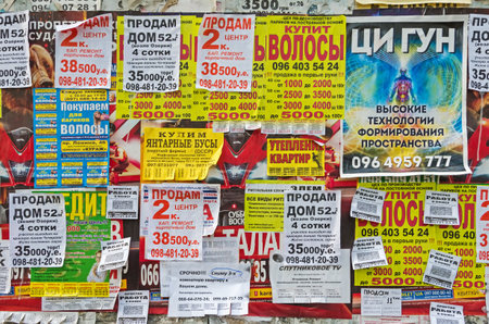 Dnepropetrovsk, Ukraine - April 14, 2016: Bulletin board with paper detachable coupons to buy, sell and exchangeのeditorial素材