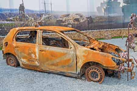 Dnipro, Ukraine - May 19, 2016: Open air museum dedicated to war in the Donbass. Burned car as a result of war in the Donbassのeditorial素材