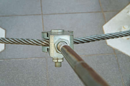Metal mount consisting of bolts and cables to secure the radio transmitting antennasの写真素材